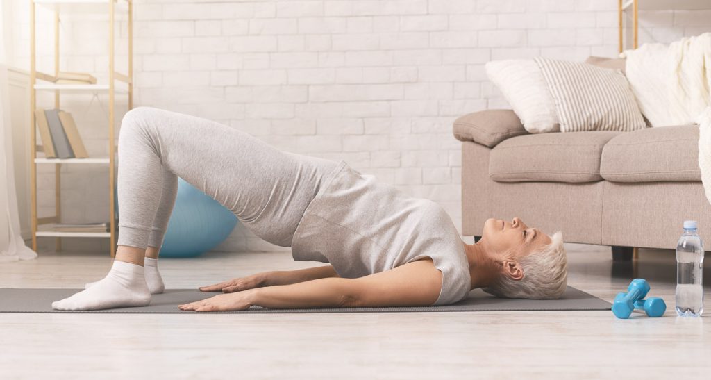 woman over 50 doing HIIT workout